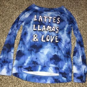blue shirt that says lattes llamas & love